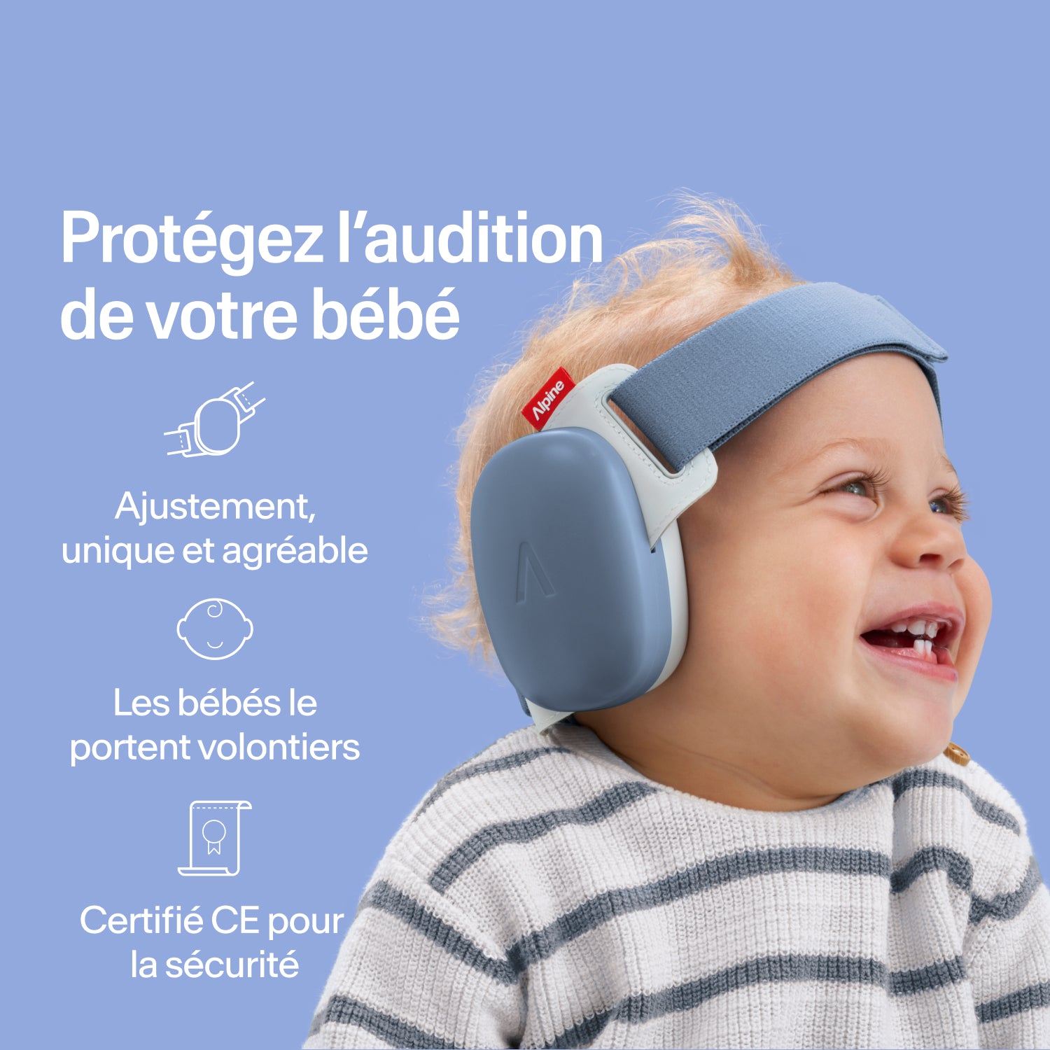 Bébé heureux portant des protège-oreilles Alpine blue, ajustement sécurisé, protection auditive certifiée CE