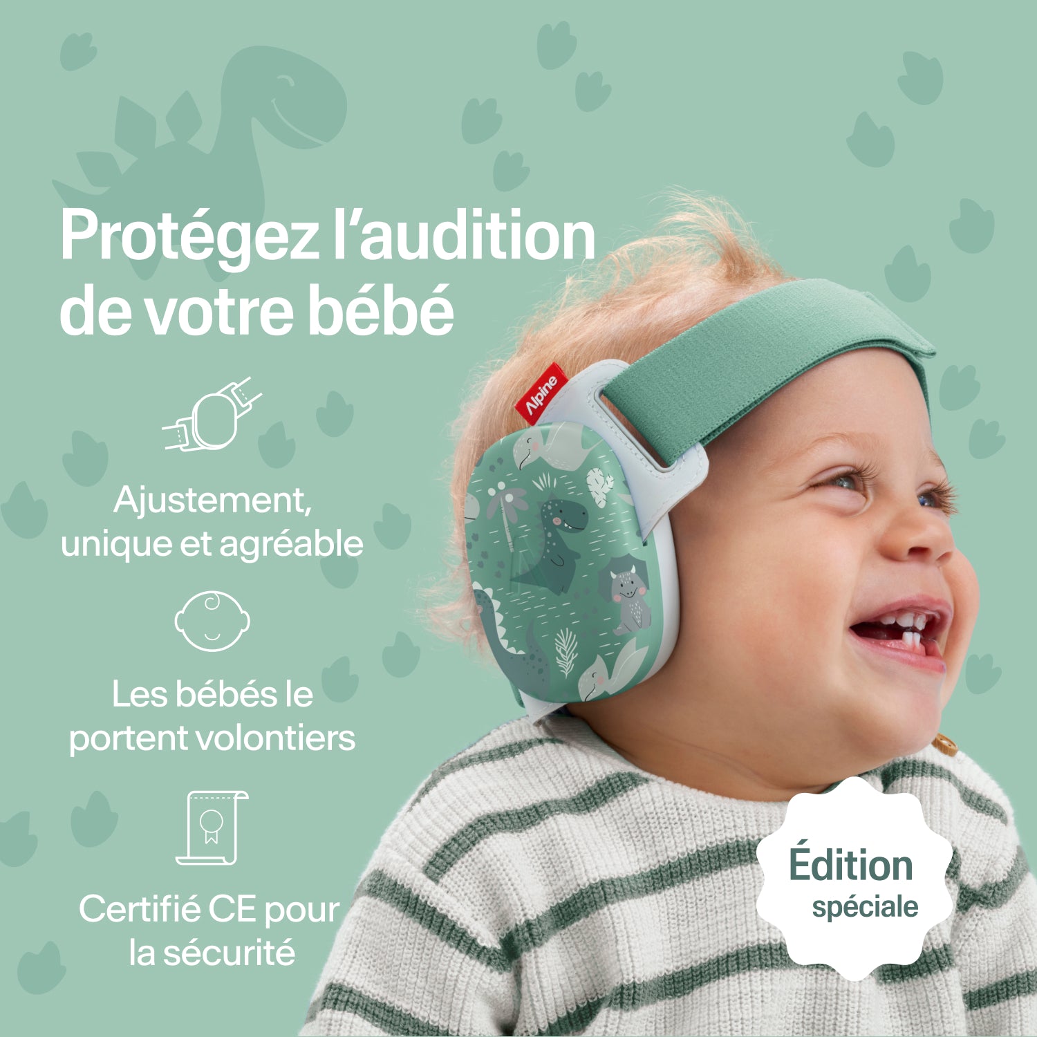 Bébé heureux portant des protège-oreilles Alpine dinos, ajustement sécurisé, protection auditive certifiée CE