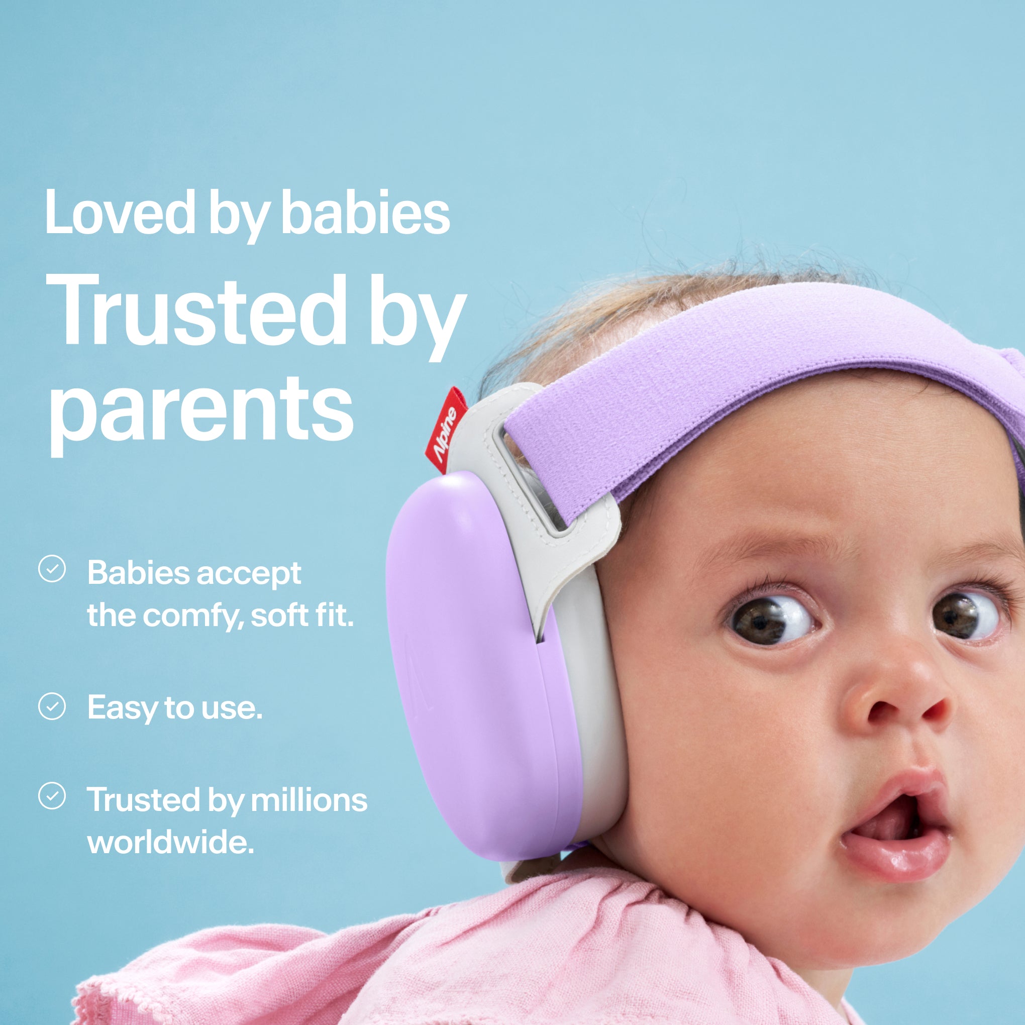 Baby wearing Alpine Muffy Baby in dawn purple on the head