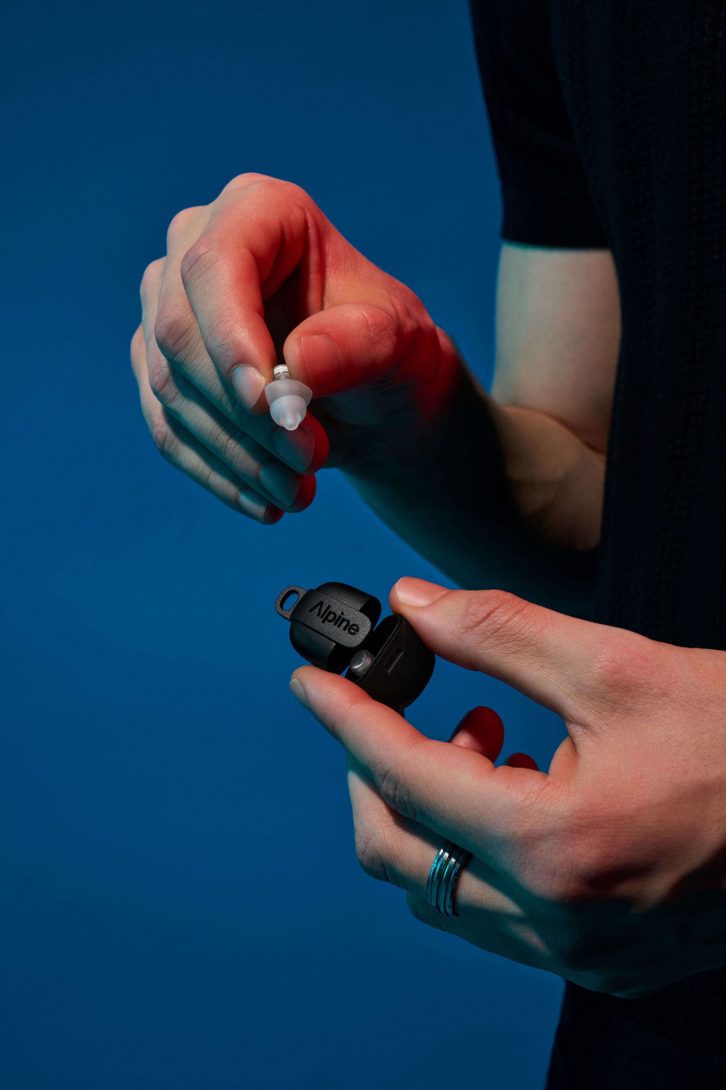 Man with Alpine PartyPlug Pro in black case