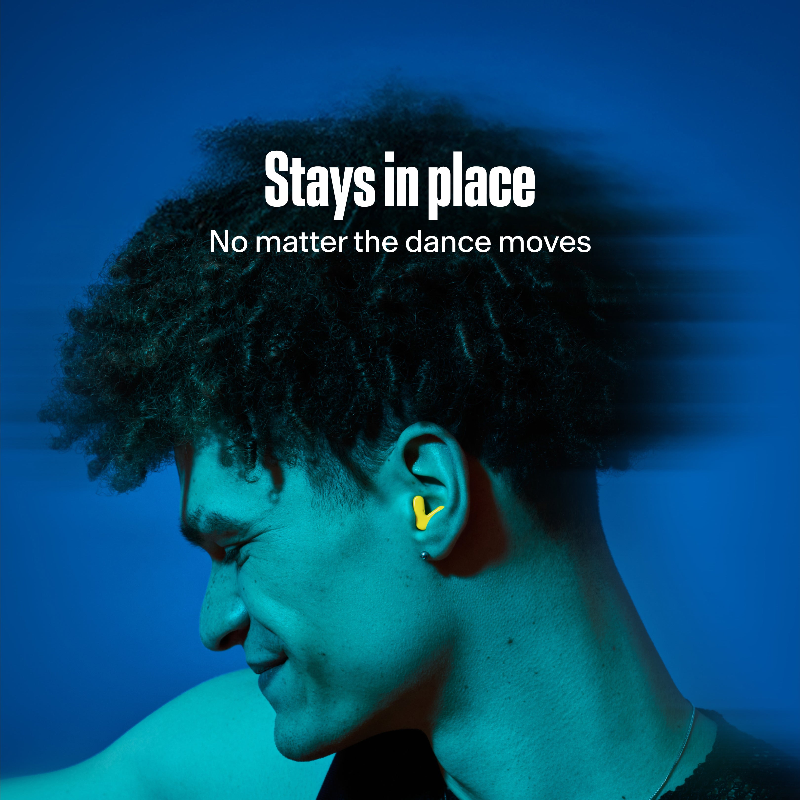 man wearing alpine tune in neon-yellow dancing with them