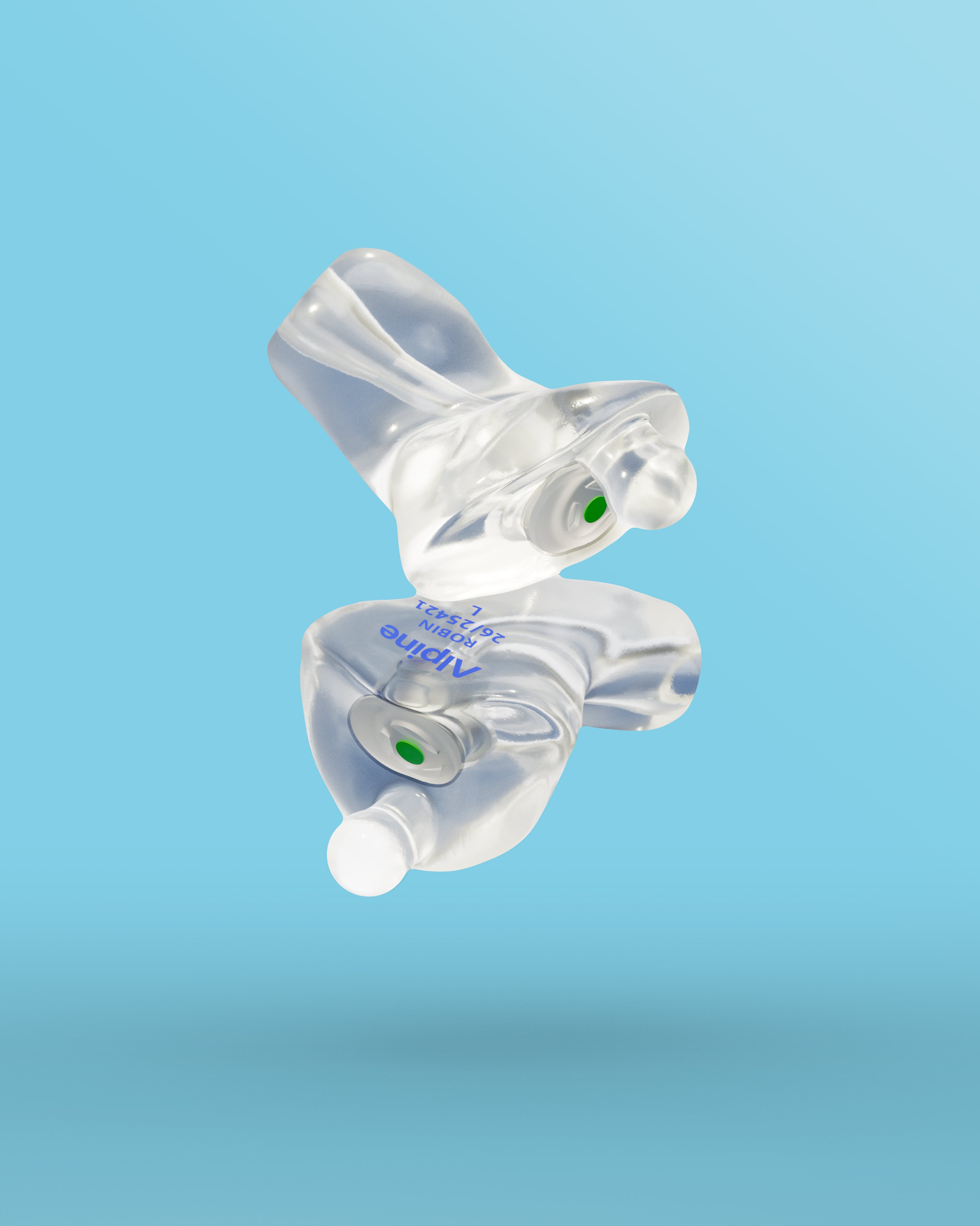 Pair of Alpine Xtreme Custom Transparent earplugs with green filters, floating against a light blue background 