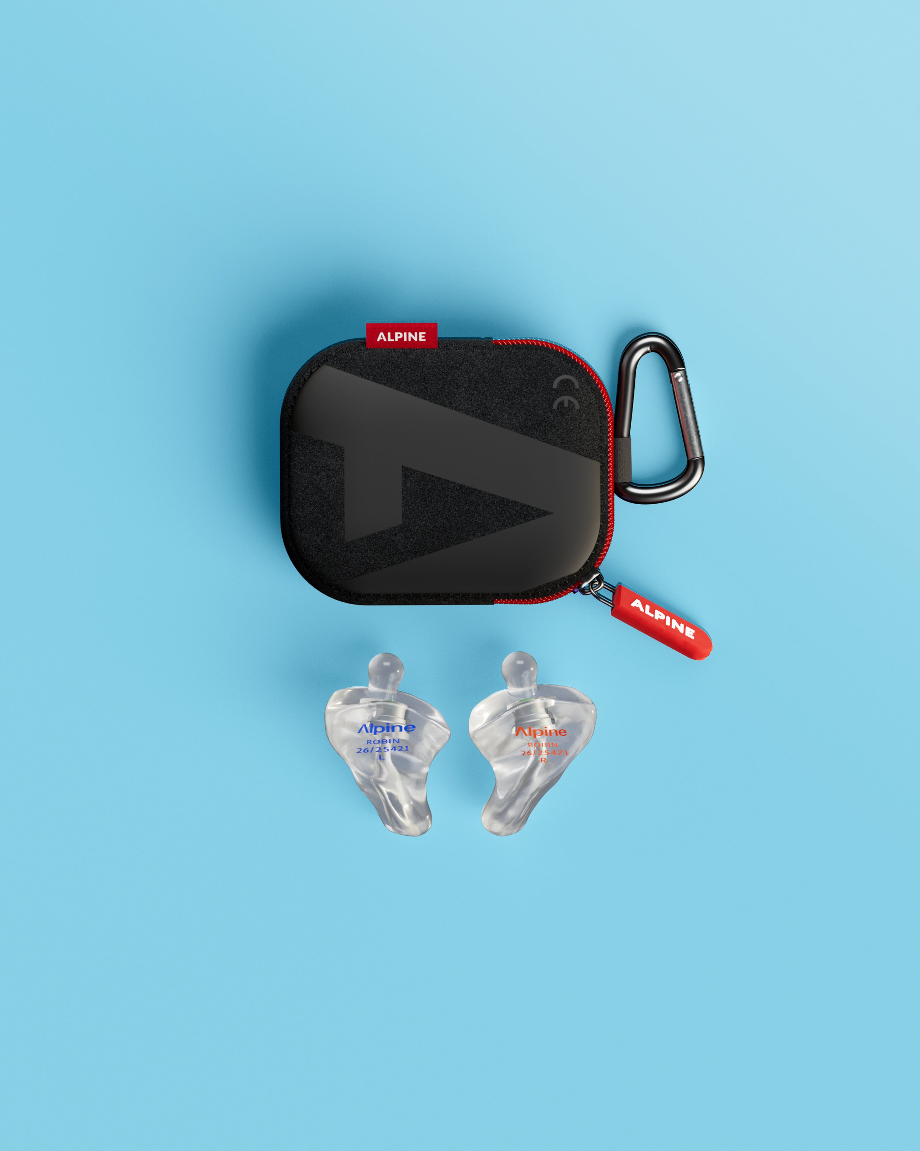 Pair of Alpine Xtreme Custom Transparent earplugs below a black carrying case with a carabiner 